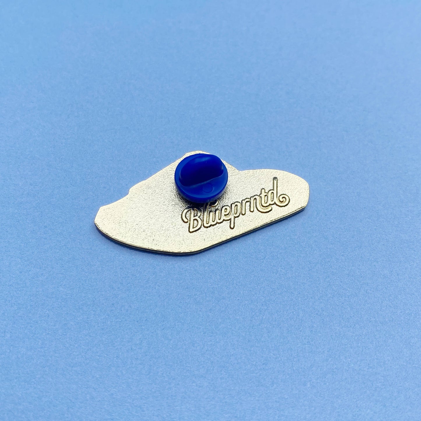 Pauper enamel pin