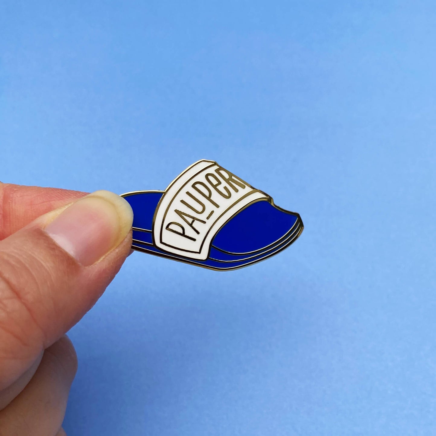 Pauper enamel pin